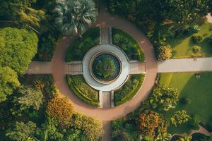 Aerial view of a circular garden with a central fountain. photo
