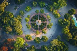 Aerial view of a circular park with lush greenery and people. photo