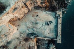 Aerial view of dilapidated waterfront ruins. photo