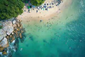 Aerial view of crowded beach with turquoise water. photo