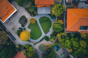 Aerial view of a residential courtyard with green spaces and buildings. photo