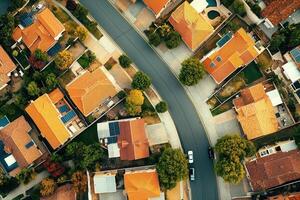 Aerial view of suburban neighborhood with houses, roads, and trees. photo