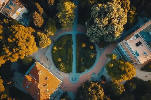 Aerial view of a circular park surrounded by buildings and lush trees. photo