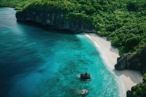 Secluded tropical beach with turquoise water and lush greenery. photo