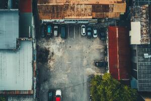 Aerial view of a city parking lot with cars and buildings. photo