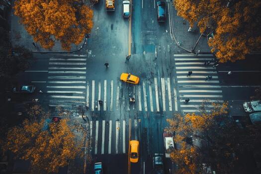 Aerial view of city intersection with yellow cabs and pedestrians. photo
