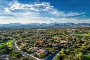 Aerial view of a residential area nestled in a mountain valley. photo