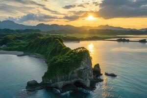 Sunset over coastal rock formation. photo