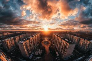 Dramatic sunset over city skyline with apartment buildings. photo