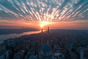 Stunning sunset over cityscape with mosque. photo
