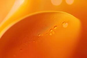 Abstract orange liquid with droplets, close-up macro. photo