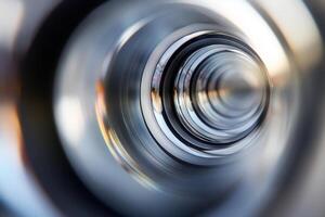 Abstract close-up of concentric metallic circles, creating a vortex effect. photo