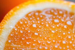 Close-up of an orange slice with water droplets. photo