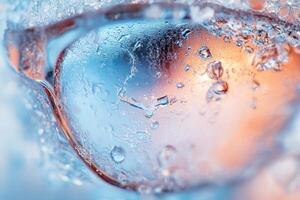 Close-up of melting ice with water droplets and warm light reflection. photo