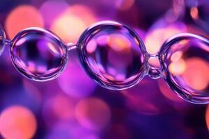 Close-up of linked translucent bubbles with purple bokeh background. photo