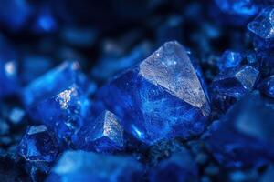 Close-up of vibrant blue crystals, glittering facets, textured surface. photo