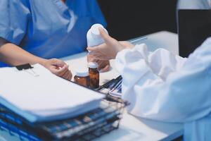 Doctor working in the office and listening to the patient, she is explaining her symptoms, healtcare and assistance concept photo