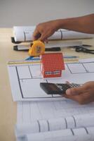 Image of engineer meeting for architectural project. working with partner and engineering tools on workplace vintage tone. photo