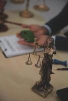 Judge gavel and miniature car symbolize auction or court case against driver who has accident and receiving vehicle insurance payment be on table in front of hands of lawyers. Selective focus photo