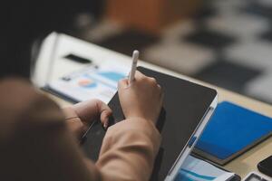 business documents businessman check legal document review Prepare documents or analysis reports, tax items, accounting documents, data contracts, office partner agreements. photo