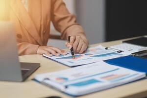 business documents businessman check legal document review Prepare documents or analysis reports, tax items, accounting documents, data contracts, office partner agreements. photo