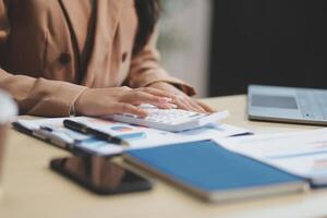 business documents businessman check legal document review Prepare documents or analysis reports, tax items, accounting documents, data contracts, office partner agreements. photo
