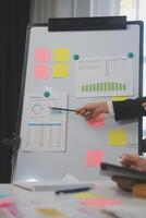 Meeting of business executives discussing analysis of the company's financial situation and business planning with partner collaboration and consultation of strategy. photo