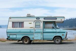 A Classic Retro Blue RV Camper Parked in a Scenic Outdoor Setting for a Nostalgic Adventure photo