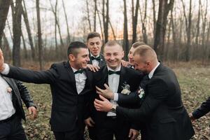 A group of men in suits are posing for a photo