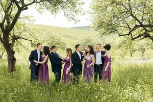 A group of people are posing for a photo in a field