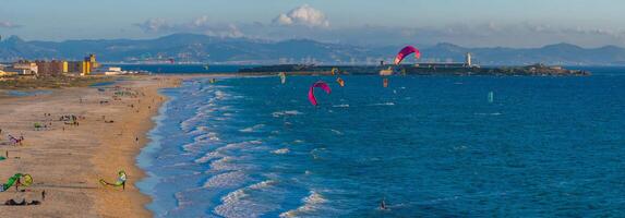 Aerial View of Tarifa's Coastline with Kite Surfers and Lighthouse photo