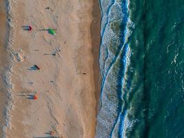 Aerial View of Tarifa Beach with Colorful Kites and Turquoise Ocean photo