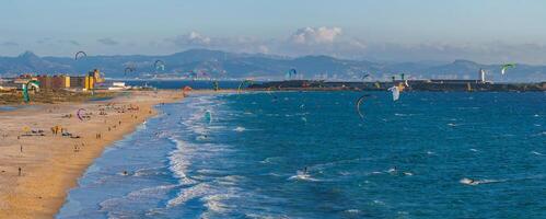 Aerial View of Tarifa Beach with Kite Surfers and Lighthouse photo
