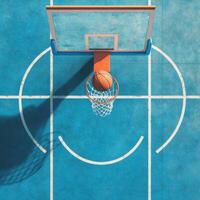 shot of a basketball court, with a basketball flying towards a perfectly aligned hoop photo