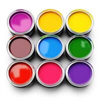 Canisters with colorful paints isolated on white photo