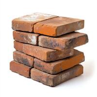 Stack of few red bricks on white background photo