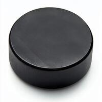 classic hockey puck, made of rubber, isolated on a pure white background photo