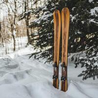 wooden yellow skis on the white snow, winter background photo
