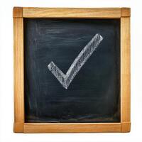 Check box with a tick drawn in chalk on a blackboard photo