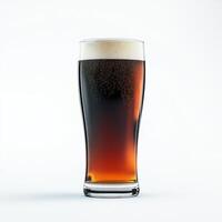 Refreshing glass of beer is standing on a white background photo