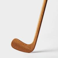 classic wooden hockey stick on white background photo