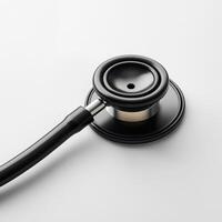 image of a black stethoscope on a clean, white background photo