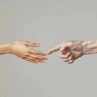 A striking image of two hands side by side, one representing youth and the other age photo