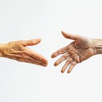 handshake between two elderly people. Symbolizes understanding between each other photo