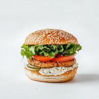 Tasty burger with fresh ingredients on sesame bun standing on white background photo