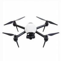 Modern white quadcopter drone hovering with camera in focus photo