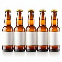 Five brown beer bottles standing in a row with blank labels photo