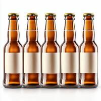 Row of five brown glass beer bottles standing on white background with blank labels photo