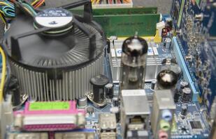 A close up of a computer motherboard with various components photo
