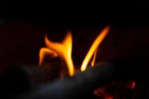 Burning wood branch texture for warm and atmospheric backgrounds in creative or professional projects photo